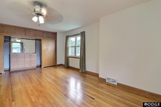 405 W 20th St, Fremont, NE 68025 - unfurnished bedroom featuring light wood-style floors, a closet, and ceiling fan
