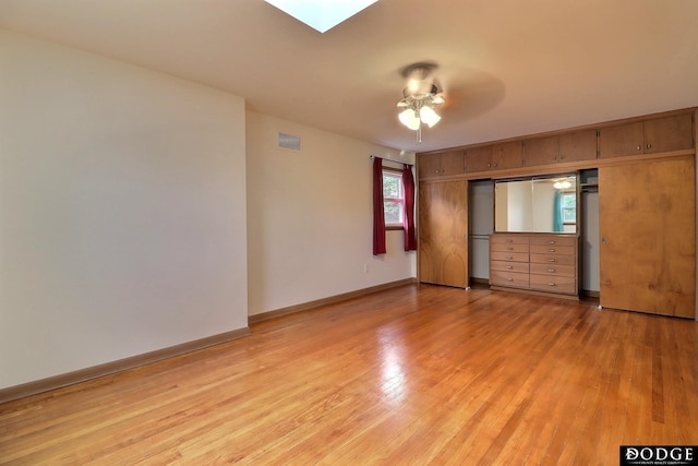 405 W 20th St, Fremont, NE 68025 - spare room with light wood-type flooring and a skylight
