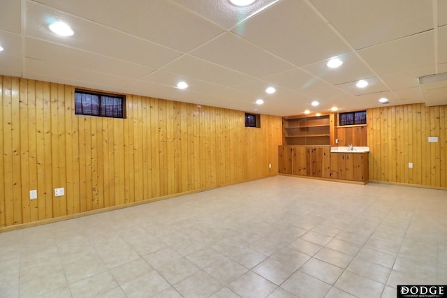 405 W 20th St, Fremont, NE 68025 - finished basement featuring wooden walls, recessed lighting, a drop ceiling, and light flooring
