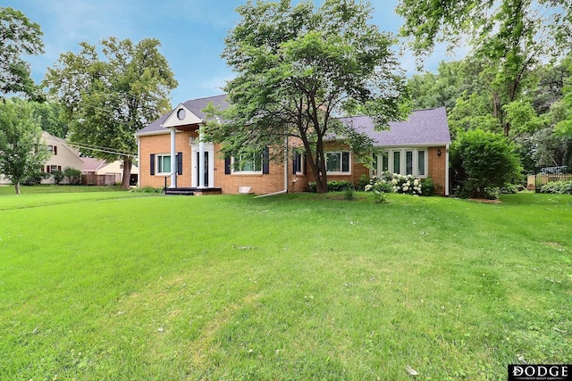 405 W 20th St, Fremont, NE 68025 - view of front facade with brick siding and a front yard