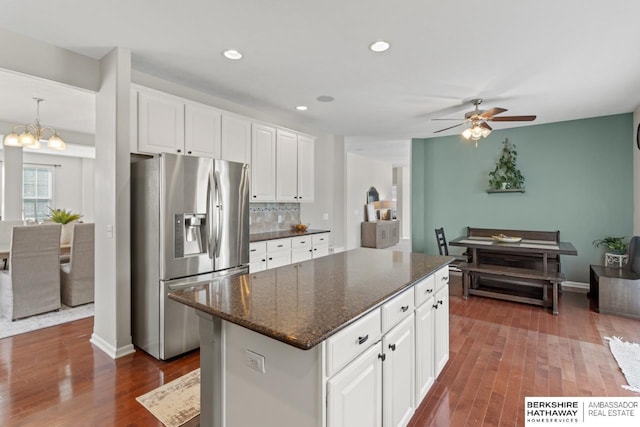 8917 N 157th St, Bennington, NE 68007 - kitchen featuring stainless steel fridge with ice dispenser, dark wood-style flooring, decorative backsplash, a center island, and recessed lighting