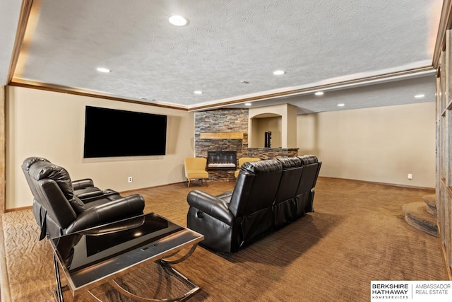 8917 N 157th St, Bennington, NE 68007 - home theater room with carpet, a fireplace, a textured ceiling, recessed lighting, and arched walkways