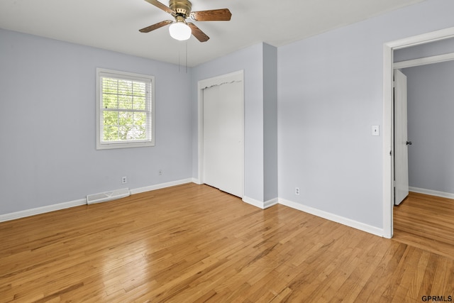 1309 Hansen Ave, Bellevue, NE 68005 - unfurnished bedroom with light wood-style flooring, a closet, and a ceiling fan