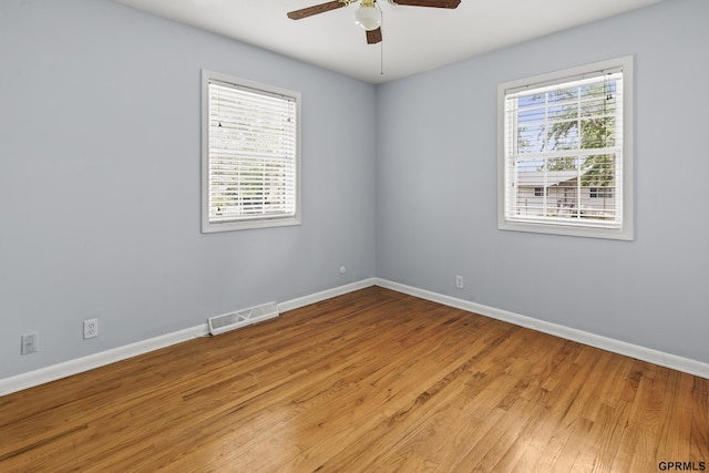 1309 Hansen Ave, Bellevue, NE 68005 - unfurnished room featuring a ceiling fan and wood finished floors
