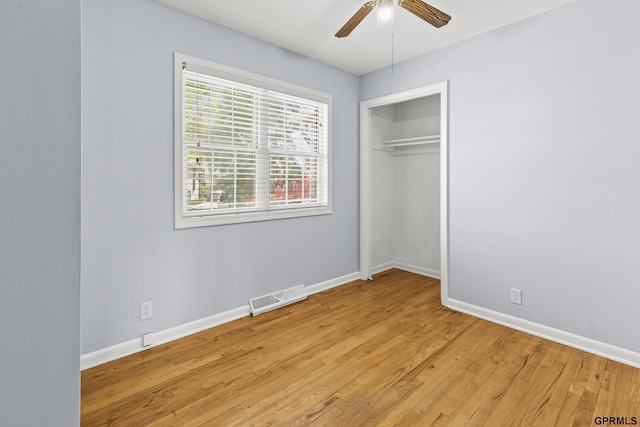 1309 Hansen Ave, Bellevue, NE 68005 - unfurnished bedroom with light wood-style floors, ceiling fan, and a closet