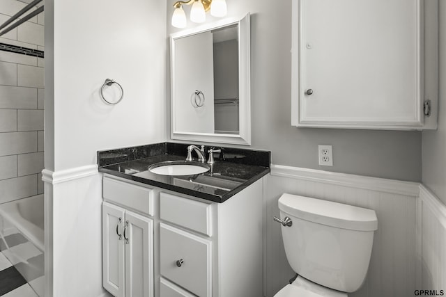 1309 Hansen Ave, Bellevue, NE 68005 - bathroom featuring a wainscoted wall, vanity, and bathing tub / shower combination