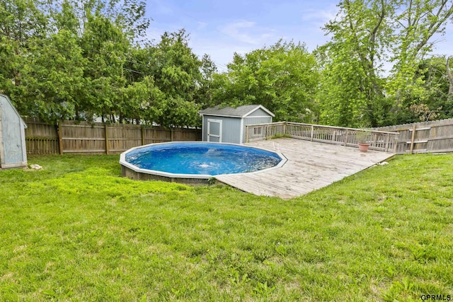 1309 Hansen Ave, Bellevue, NE 68005 - view of pool with a shed, a fenced backyard, and a wooden deck