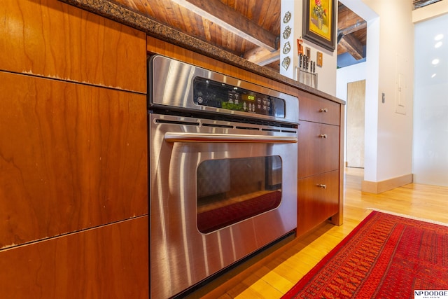 105 S 9th St Unit 308, Omaha, NE 68102 - kitchen with oven, wood finished floors, and beamed ceiling