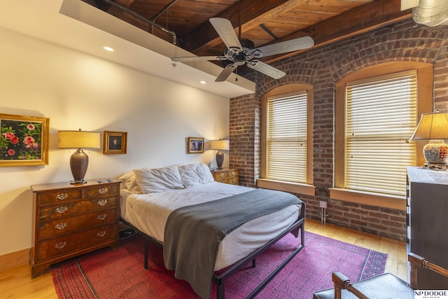 105 S 9th St Unit 308, Omaha, NE 68102 - bedroom featuring brick wall, wood-type flooring, beam ceiling, ceiling fan, and recessed lighting