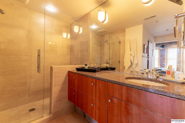 105 S 9th St Unit 308, Omaha, NE 68102 - bathroom with a shower stall, vanity, and tile patterned flooring