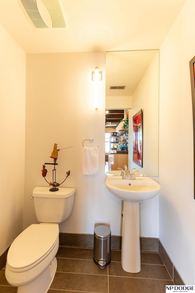 105 S 9th St Unit 308, Omaha, NE 68102 - half bath with toilet and tile patterned floors