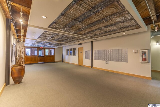 105 S 9th St Unit 308, Omaha, NE 68102 - carpeted empty room with mail area and an ornate ceiling