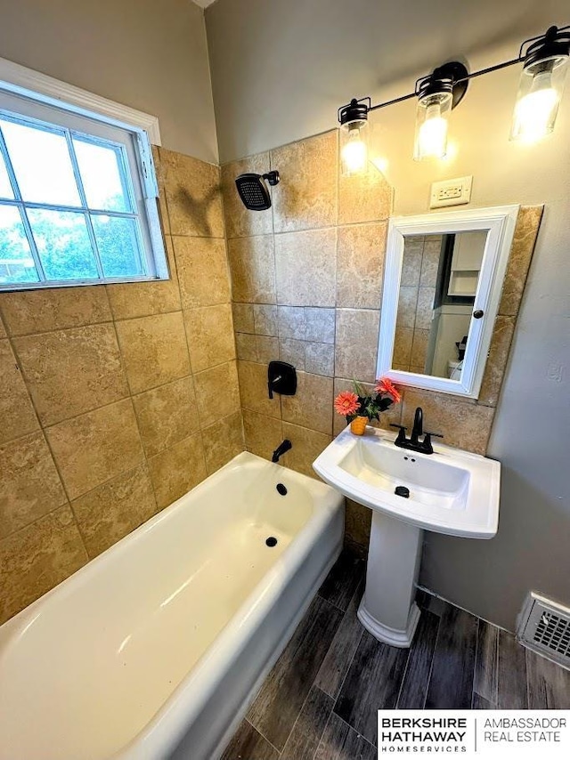 623 S 33rd St, Omaha, NE 68105 - bathroom with  shower combination and wood finished floors