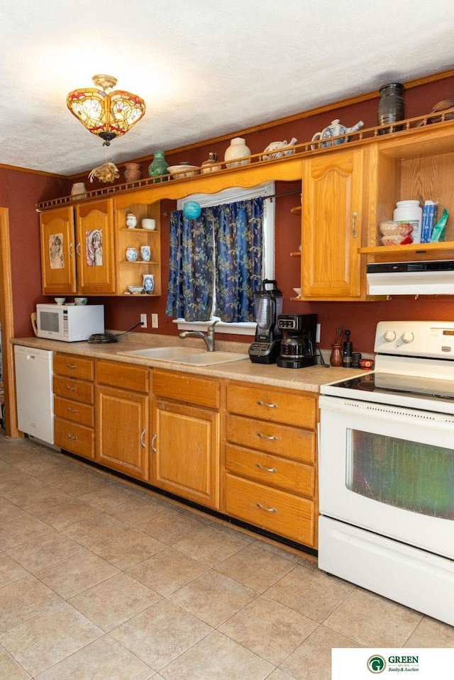 503 E 12th St, York, NE 68467 - kitchen with white appliances, open shelves, under cabinet range hood, light tile patterned floors, and light countertops