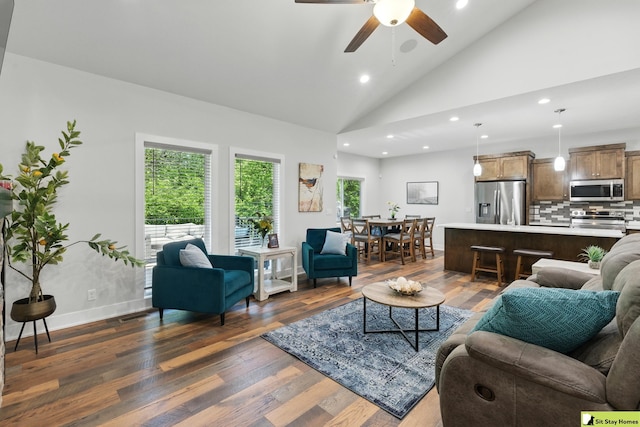 15436 Fowler Ave, Omaha, NE 68116 - living area with vaulted ceiling, recessed lighting, dark wood-style floors, and a ceiling fan