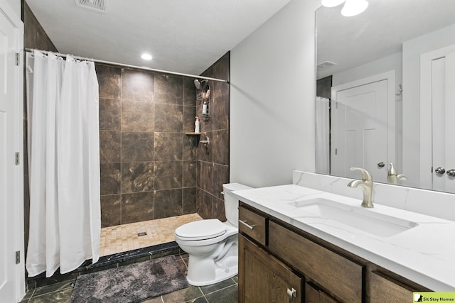 15436 Fowler Ave, Omaha, NE 68116 - bathroom with vanity, tiled shower, and recessed lighting