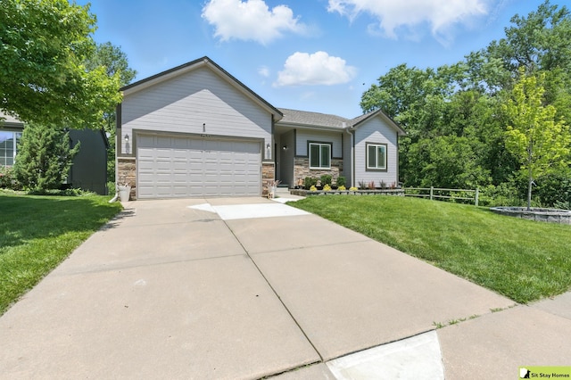 15436 Fowler Ave, Omaha, NE 68116 - view of front of house with an attached garage, driveway, stone siding, and a front yard