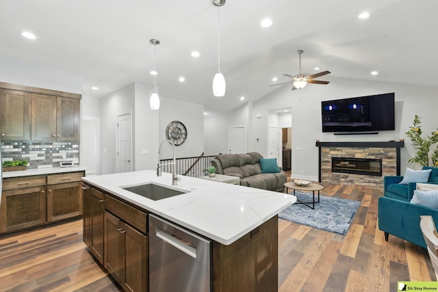 15436 Fowler Ave, Omaha, NE 68116 - kitchen featuring dishwasher, open floor plan, ceiling fan, backsplash, and vaulted ceiling