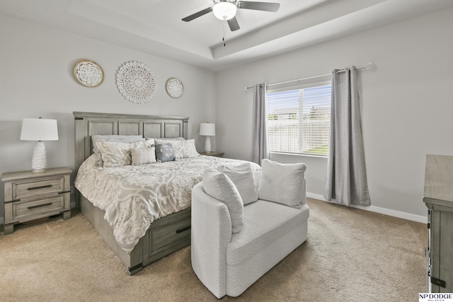 5003 N 180th Ave, Elkhorn, NE 68022 - bedroom with light carpet, a tray ceiling, and a ceiling fan