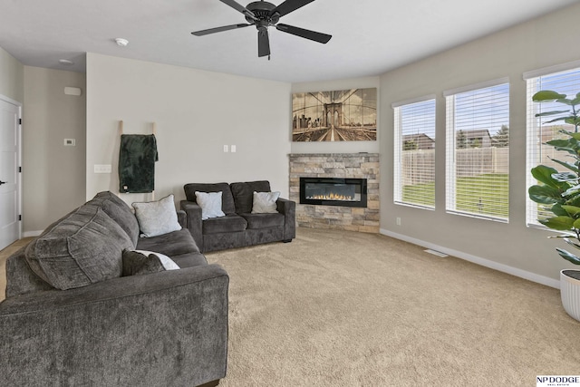 5003 N 180th Ave, Elkhorn, NE 68022 - carpeted living area featuring a fireplace and ceiling fan