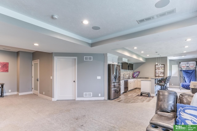 20761 Shirley St, Omaha, NE 68022 - living room featuring light carpet, recessed lighting, and a textured ceiling