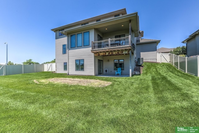 20761 Shirley St, Omaha, NE 68022 - back of property with a fenced backyard, a balcony, a patio area, and a gate