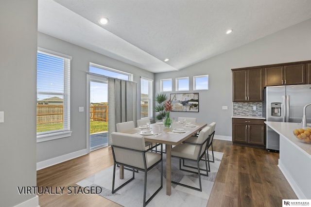 7530 Augustine Ave, Lincoln, NE 68516 - dining room with vaulted ceiling, dark wood-style flooring, and recessed lighting