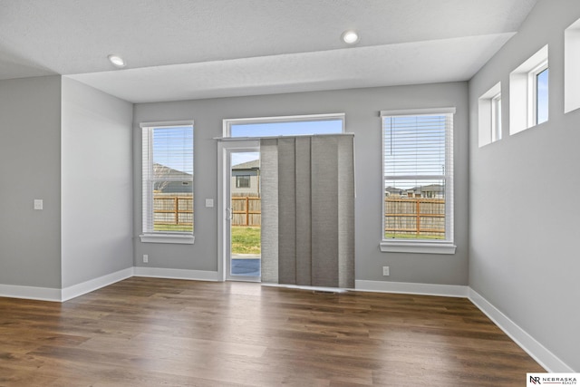 7530 Augustine Ave, Lincoln, NE 68516 - empty room with wood finished floors, plenty of natural light, and recessed lighting