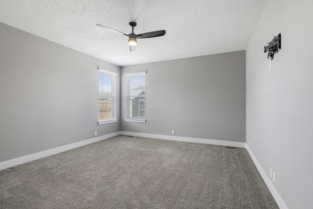 7530 Augustine Ave, Lincoln, NE 68516 - carpeted empty room featuring a textured ceiling and ceiling fan