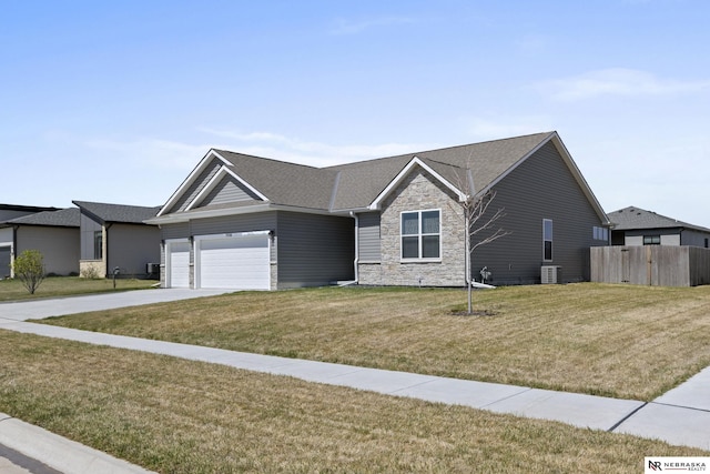 7530 Augustine Ave, Lincoln, NE 68516 - ranch-style home with stone siding, driveway, a shingled roof, and an attached garage