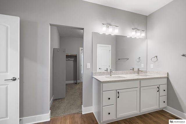 7530 Augustine Ave, Lincoln, NE 68516 - bathroom with double vanity and wood finished floors