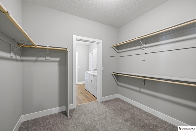 7530 Augustine Ave, Lincoln, NE 68516 - spacious closet featuring washer and clothes dryer and light carpet