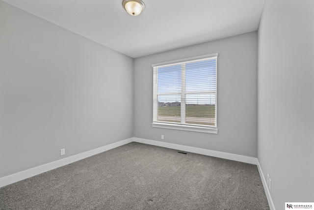 7530 Augustine Ave, Lincoln, NE 68516 - unfurnished room featuring baseboards and carpet floors