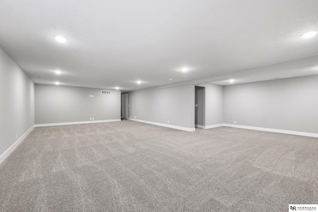 7530 Augustine Ave, Lincoln, NE 68516 - finished below grade area with recessed lighting and light colored carpet