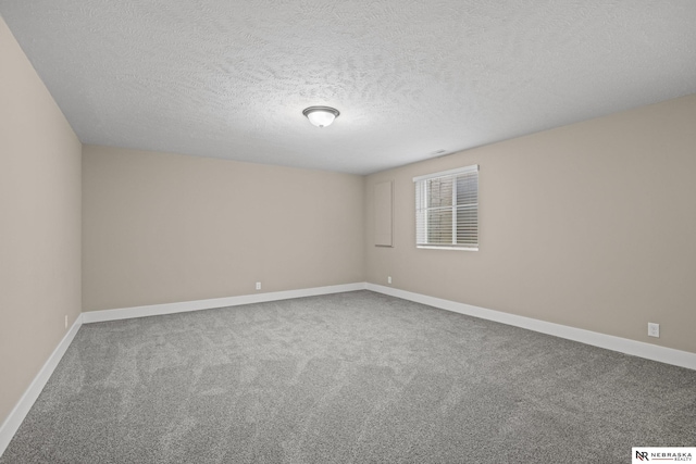 7530 Augustine Ave, Lincoln, NE 68516 - unfurnished room featuring carpet flooring and a textured ceiling