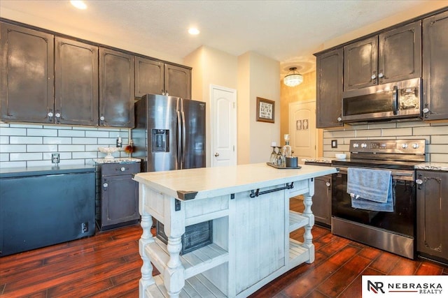 16228 Virginia St, Omaha, NE 68136 - kitchen with stainless steel appliances, dark wood-style flooring, light countertops, and recessed lighting
