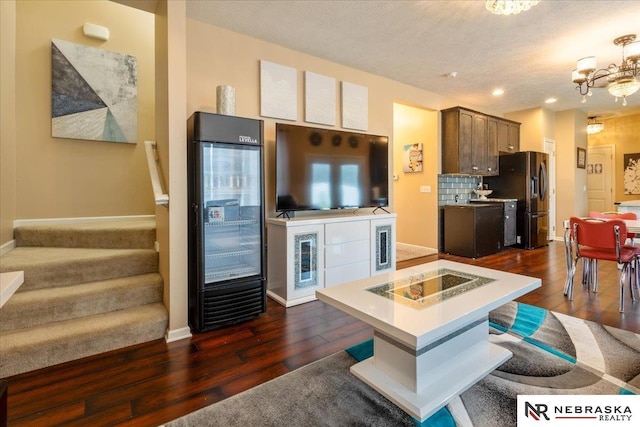 16228 Virginia St, Omaha, NE 68136 - kitchen featuring refrigerator with ice dispenser, dark wood finished floors, a chandelier, light countertops, and recessed lighting