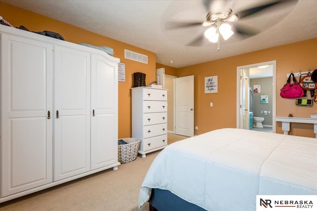 16228 Virginia St, Omaha, NE 68136 - bedroom with light carpet, connected bathroom, and ceiling fan
