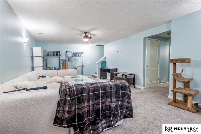 16228 Virginia St, Omaha, NE 68136 - carpeted living area with a textured ceiling, ceiling fan, and stairway