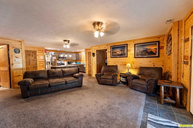 817 S 3rd St, Nebraska City, NE 68410 - living area featuring wooden walls and ceiling fan