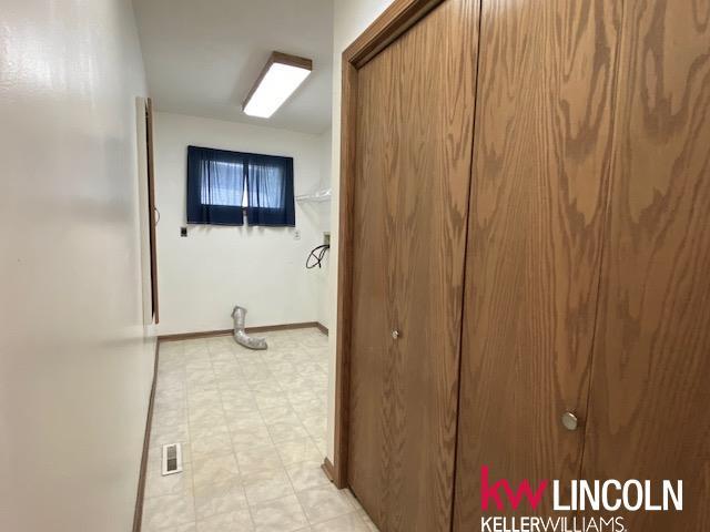 2930 Drawbridge Ct, Lincoln, NE 68516 - hall with light floors and baseboards