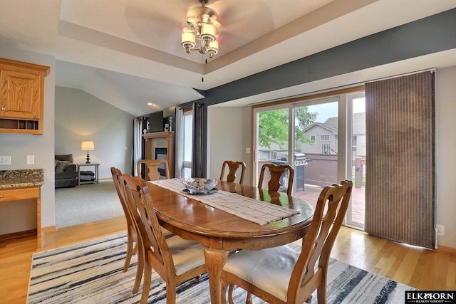 19523 Binney Cir, Elkhorn, NE 68022 - dining space featuring light wood-style flooring and vaulted ceiling