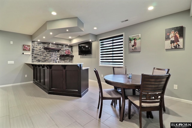 19523 Binney Cir, Elkhorn, NE 68022 - dining space featuring bar with sink and recessed lighting
