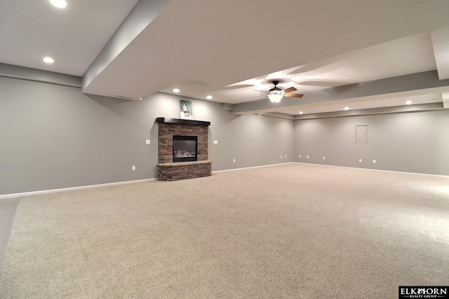 19523 Binney Cir, Elkhorn, NE 68022 - unfurnished living room with recessed lighting, a ceiling fan, carpet flooring, and a stone fireplace