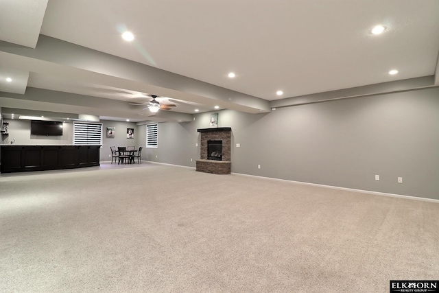 19523 Binney Cir, Elkhorn, NE 68022 - unfurnished living room featuring bar with sink, recessed lighting, light colored carpet, a ceiling fan, and a fireplace