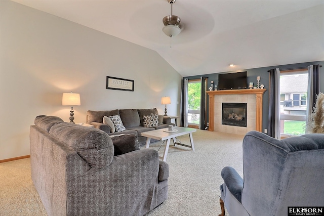 19523 Binney Cir, Elkhorn, NE 68022 - living area with carpet flooring, ceiling fan, vaulted ceiling, healthy amount of natural light, and a fireplace