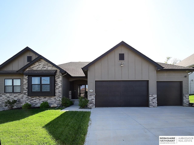 10309 S 102nd St, Papillion, NE 68046 - view of front of house with an attached garage, board and batten siding, and stone siding