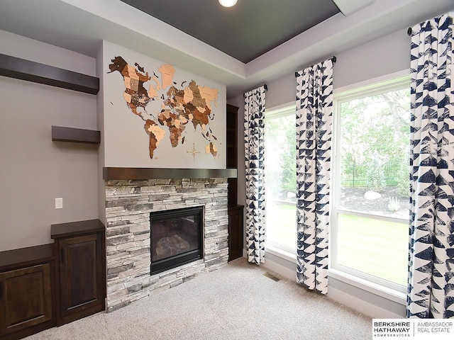 10309 S 102nd St, Papillion, NE 68046 - unfurnished living room with a fireplace, a raised ceiling, and carpet floors