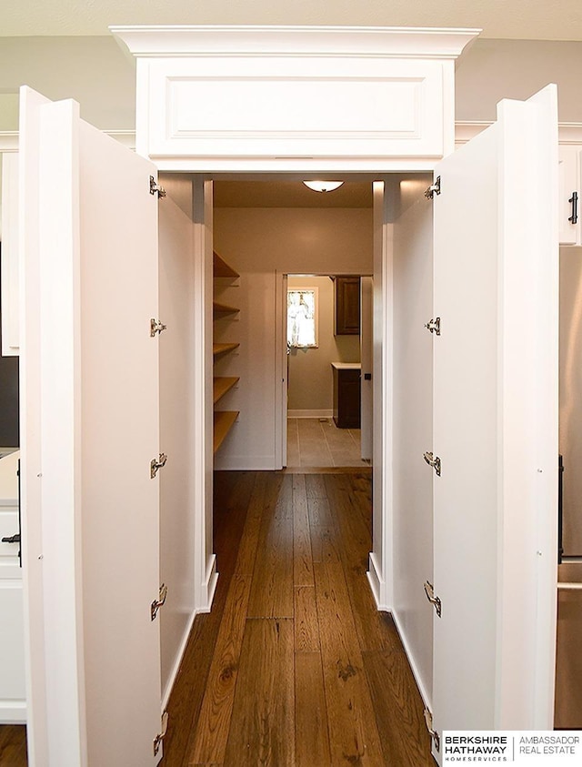 10309 S 102nd St, Papillion, NE 68046 - corridor featuring dark wood finished floors and baseboards