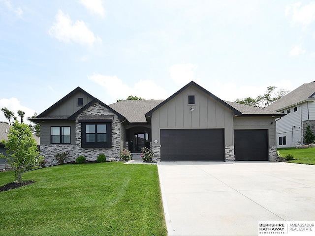 10309 S 102nd St, Papillion, NE 68046 - view of front of home with board and batten siding, a garage, driveway, and stone siding